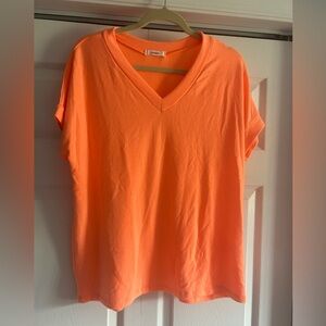 Bright orange top